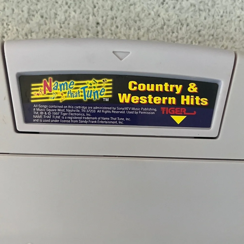 Name That Tune Handheld Game with country and western hits game Tiger toy